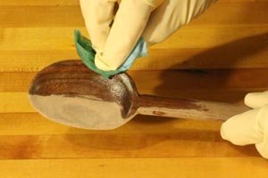 Apply a food safe finish to the wooden spoon.
