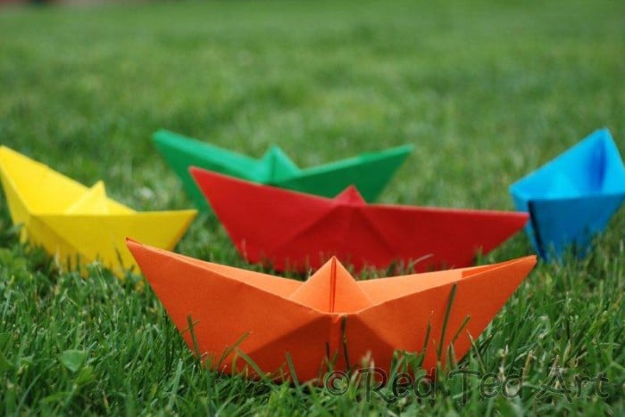 How to... make a Paper Boat! This is such an easy origami boat and it is so fun to play with, that it makes the perfect easy origami for kids to learn. We love making easy paper boats and you can decorate and play with them in so many ways. You can make tiny paper boats and GIANT origami boats. Pirate Boats or Rianbow Boats. Your choice. Check out how to make an origami boat today!! And see how easy paper boats are made.